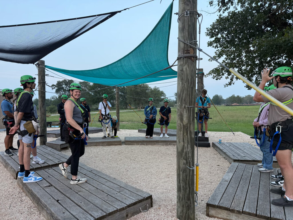 Corporate group getting ready for a group activity at Zip Lost Pines