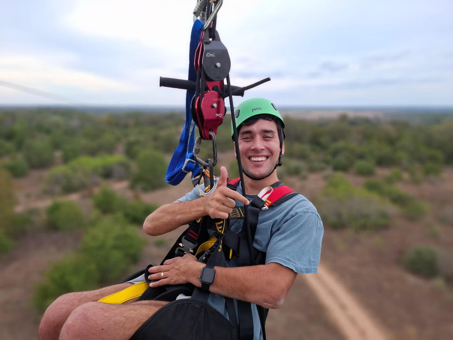 Man enjoying a fun zipline adventure at Zip Lost Pines