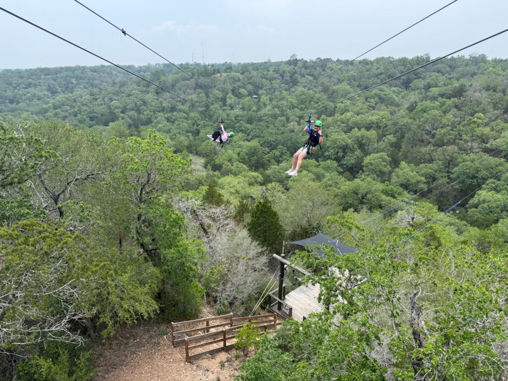 People enjoying a ziplining adventure at Zip Lost Pines in Texas