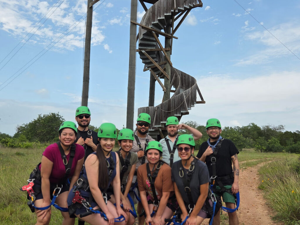 People posing before heading out for a zipline adventure at Zip Lost Pines