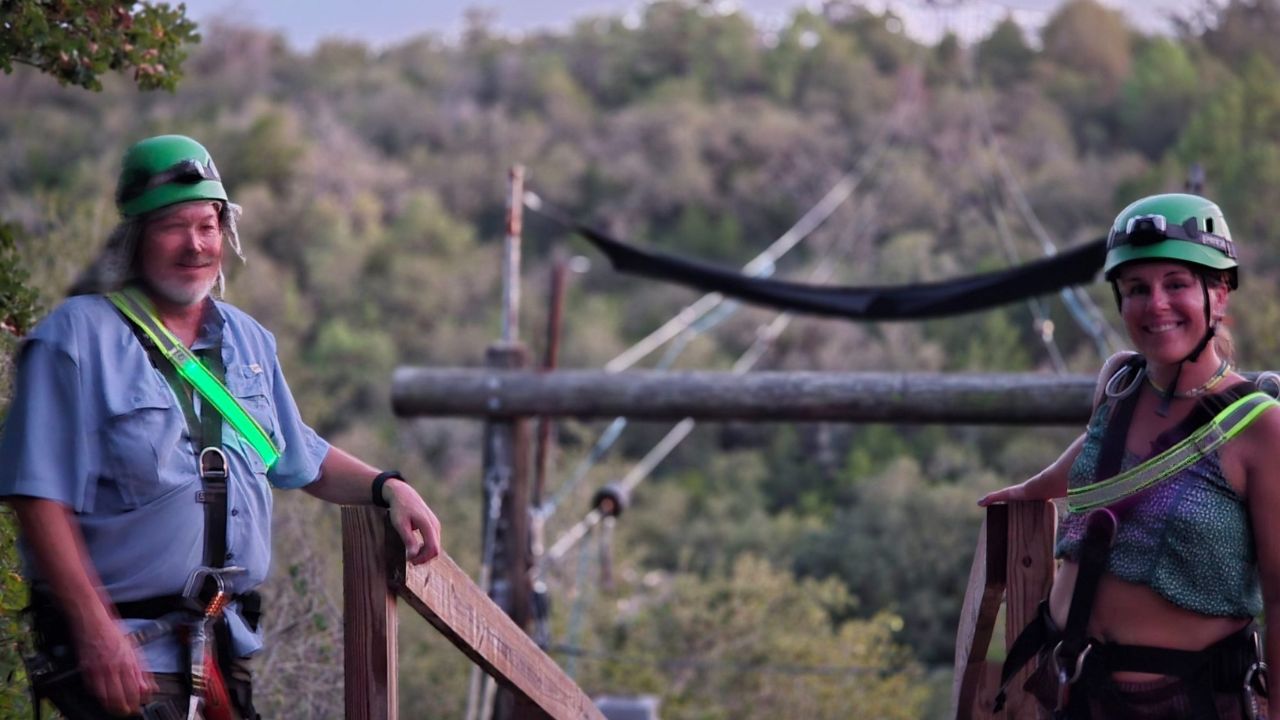 Couple posing together after their Lost Pines zipline adventure
