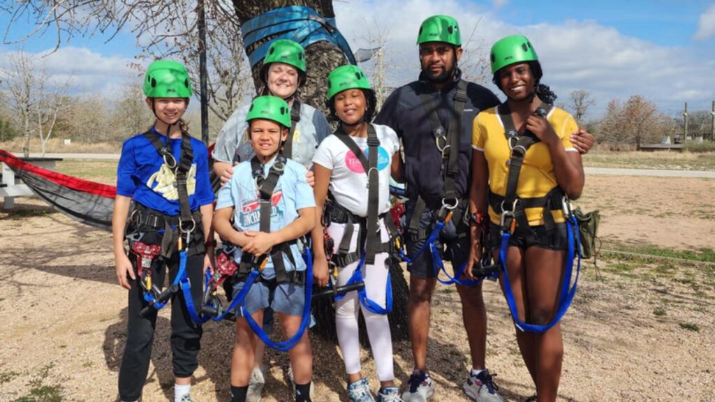 Family posing together before their zipline adventure.