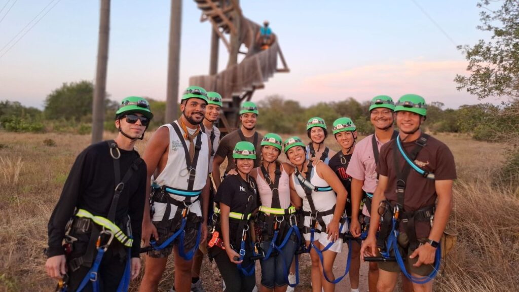oup posing together in zipline gear at Zip Lost Pines