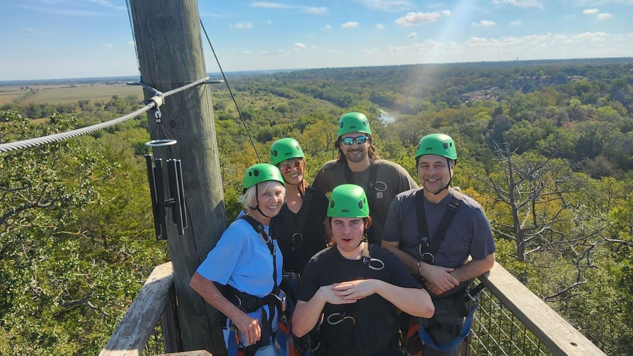  Group enjoying a shared zipline experience at Zip Lost Pines
