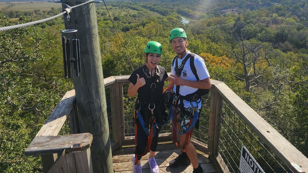 People posing together before a zipline adventure at Zip Lost Pines
