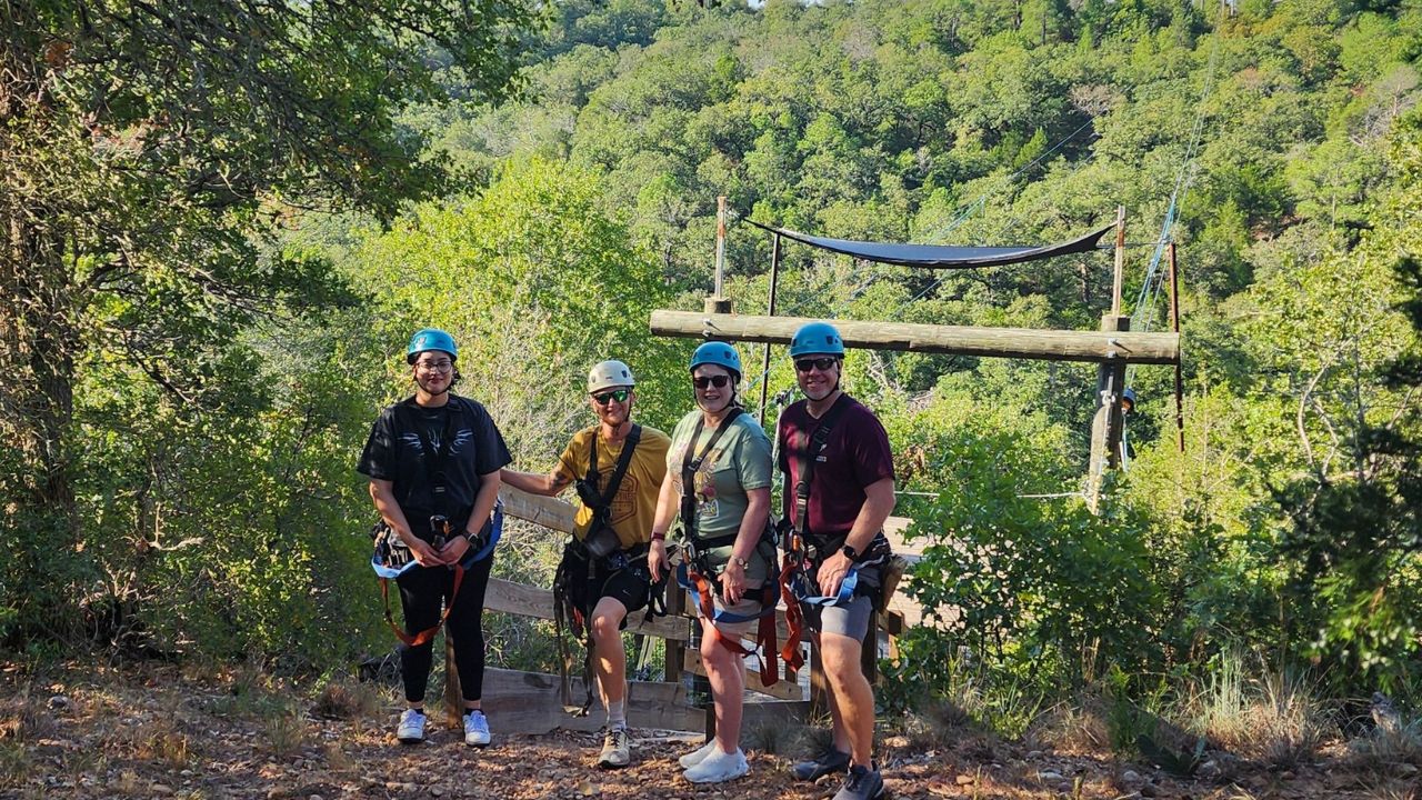 People posing and having fun at Zip Lost Pines